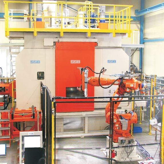 Model 3VDZ30-15 - as turnkey solution with robot handling and safety cell for forming of truck wheels